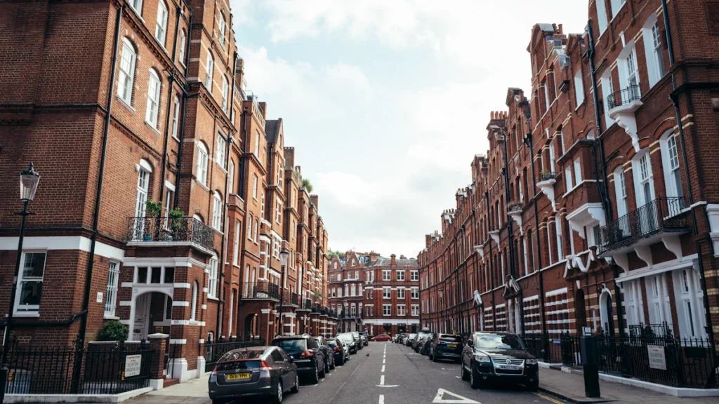 Classic red brick Victorian residential street in London during the day