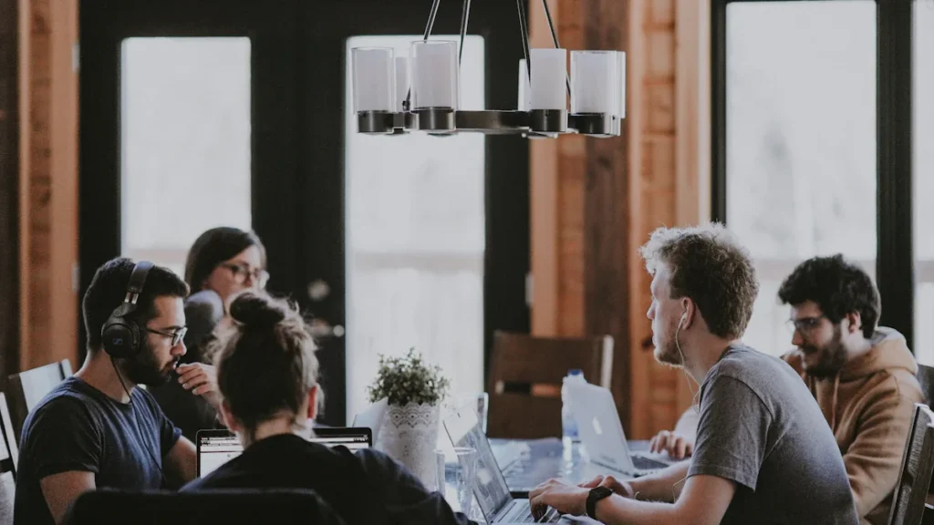 A professional team collaborating in a bright modern office setting in the UK.
