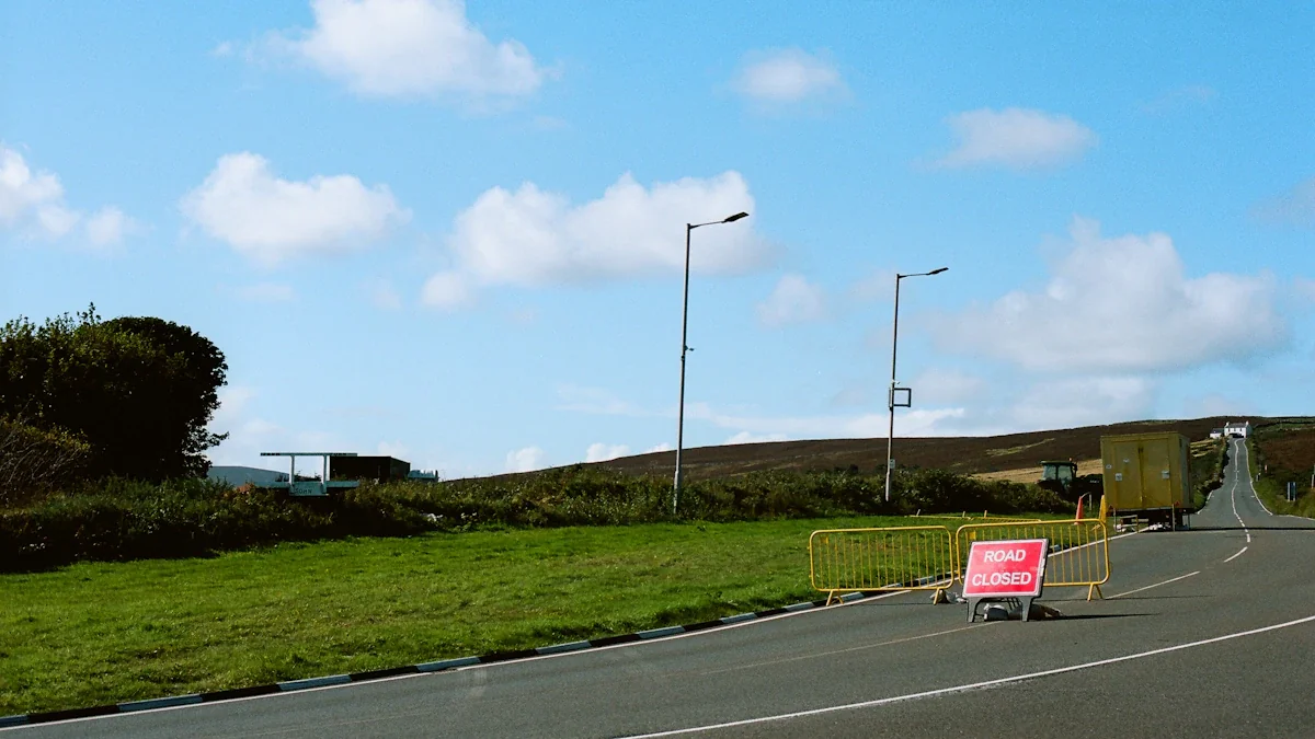Road closure sign and yellow traffic barriers on the B5470 Macclesfield Road.