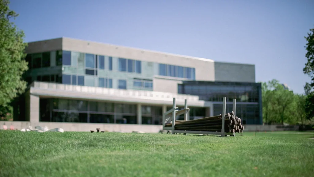 Modern building architecture with a lawn, suitable for a professional campus development article.
