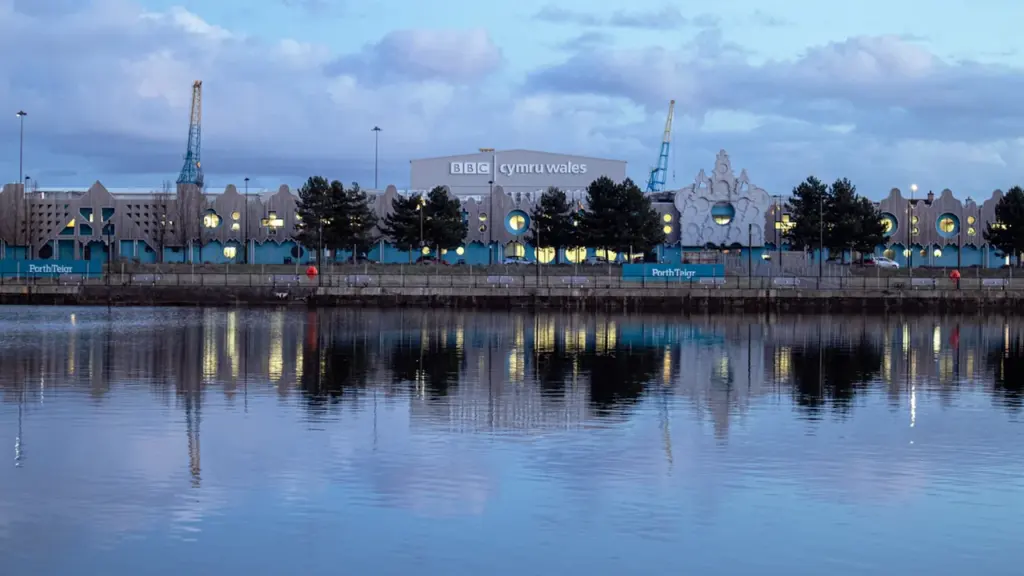 Panoramic view of Cardiff Bay with the Pierhead building and ferris wheel.