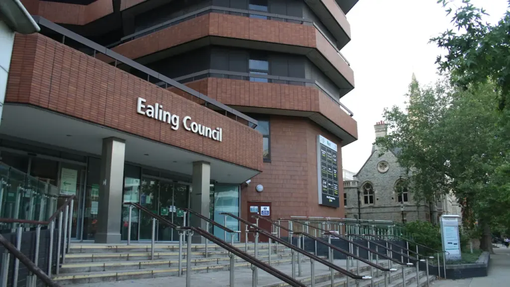 The main entrance of the Ealing Council building in London with stairs and signage.