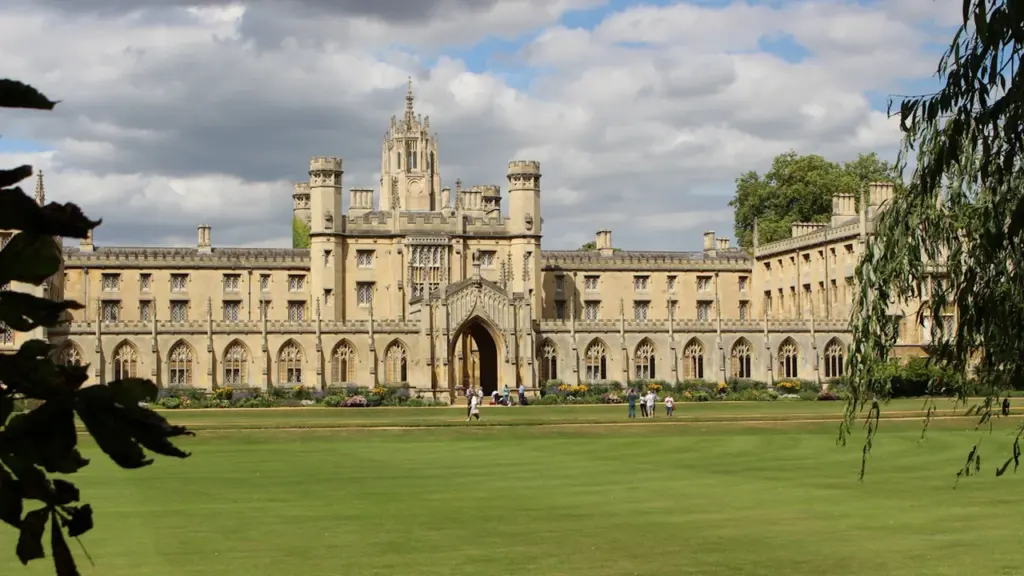 St John's College building architecture in Cambridge under a cloudy sky.