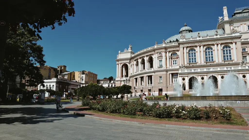 The historic Odesa Opera and Ballet Theatre featuring a grand outdoor fountain and park.
