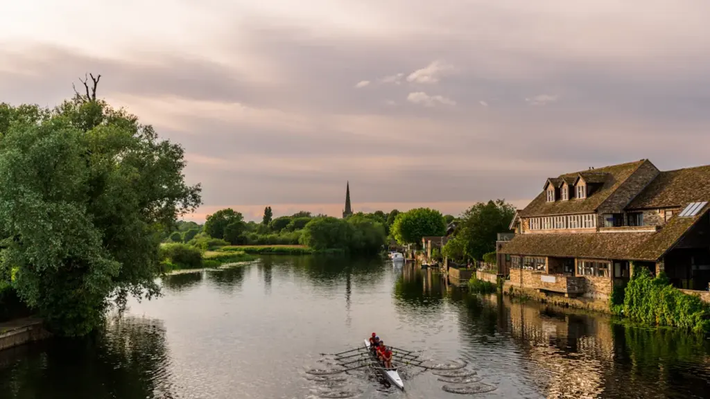 Rowing team on the River Ouse in St Ives, Cambridgeshire, at sunset.